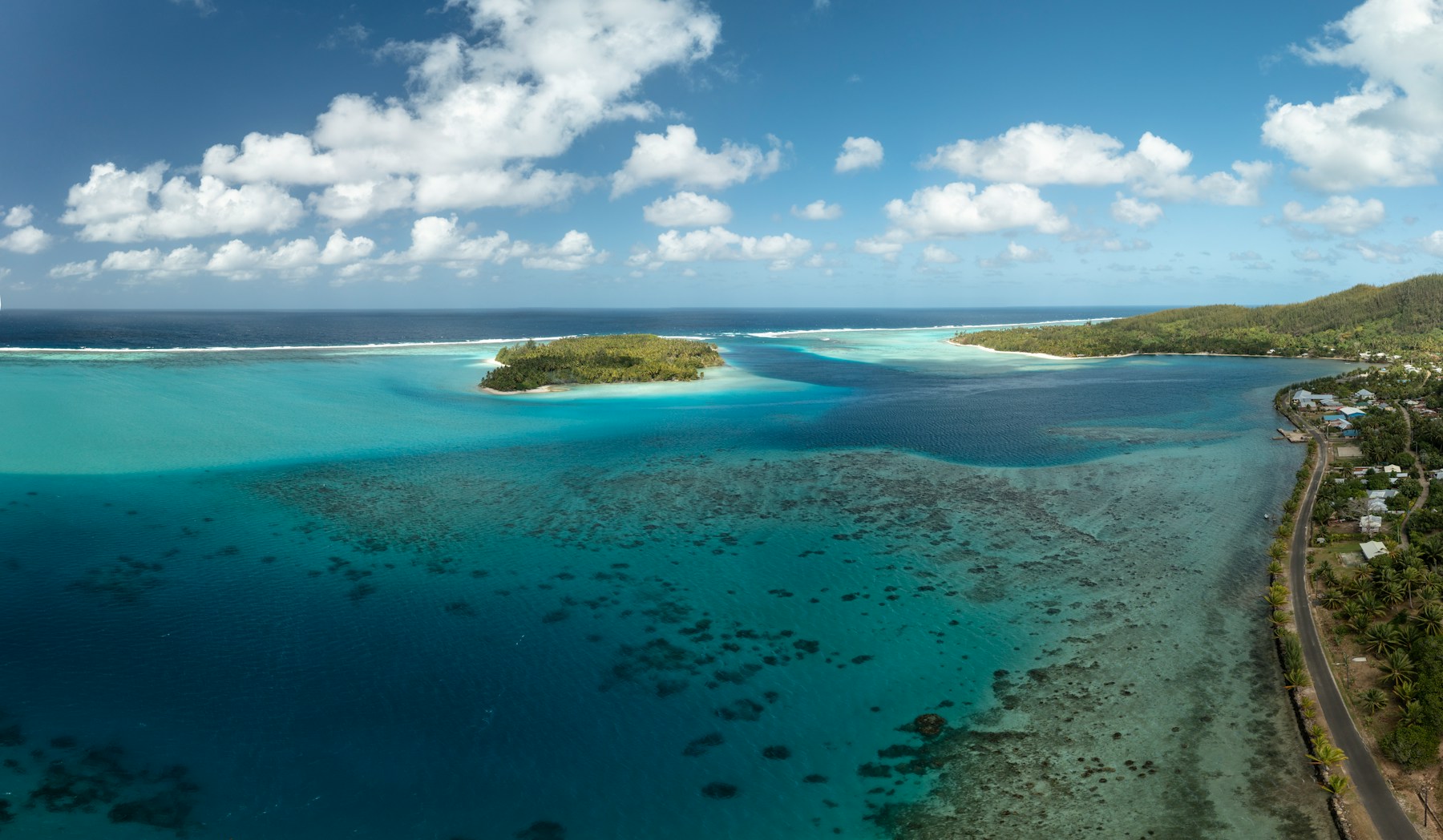 Aerial view of Huahine ringed by reef and open ocean